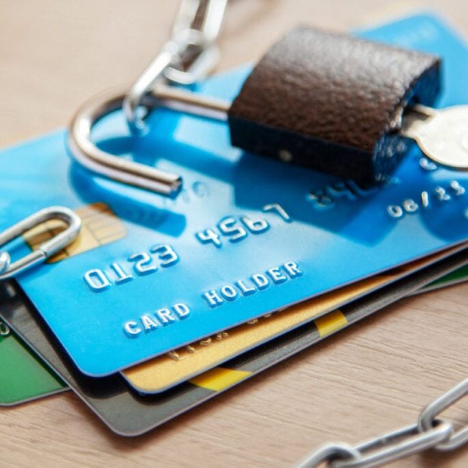 Credit cards with an open lock and chain. Open access to the use of electronic money